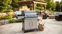 4-Burner Propane Gas Grill with Side Burner with Glass Viewing Window, Cabinet Style, Silver — Lifestyle